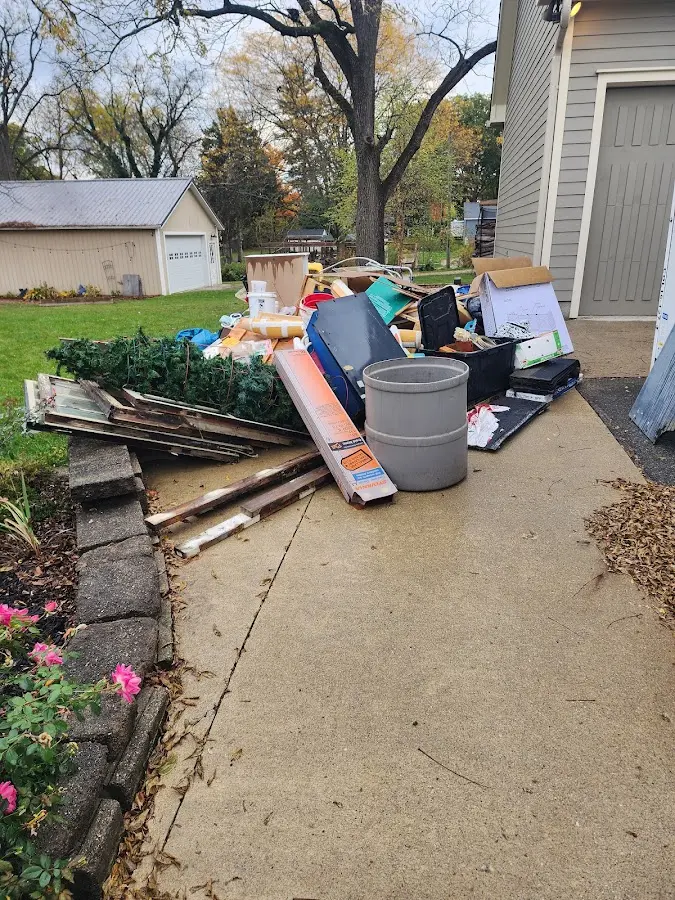 Dumpster being loaded with debris for Residential Dumpster Rental in Moorpark